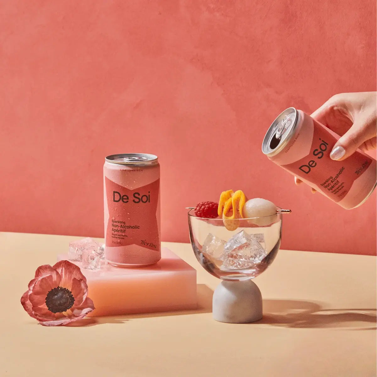 Adaptogen drinks featuring a can of De Soi non-alcoholic apéritif being poured into a glass with fruit garnish.