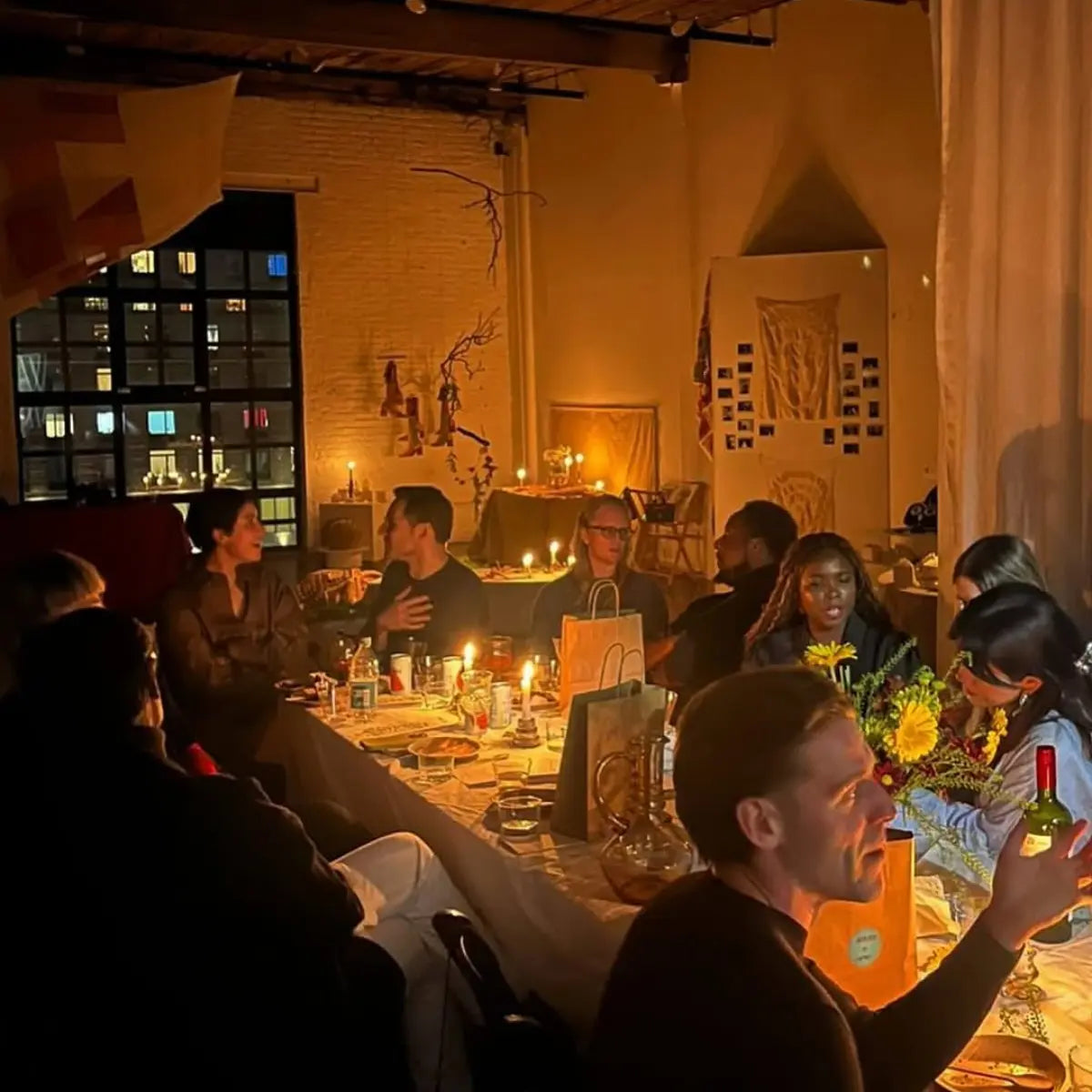 Zero-proof drinks set the mood at a candlelit gathering, where guests enjoy conversation and alcohol-free beverages at a cozy table.