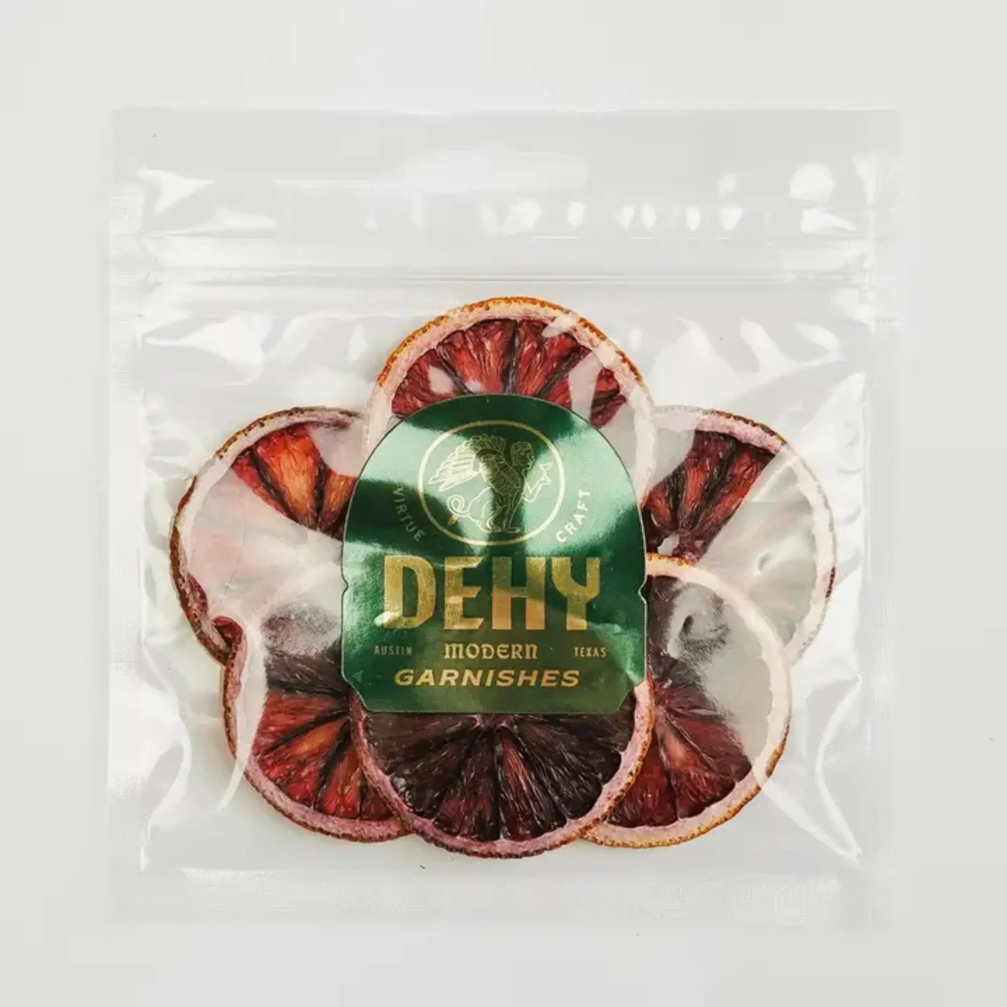 DEHY Modern Garnishes package of dried blood orange slices in a resealable clear bag.