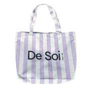 Lilac and white striped canvas De Soi tote bag with navy logo and handles.